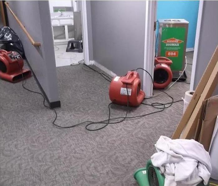 Air movers drying floor
